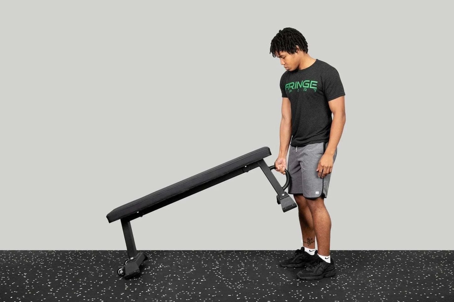 Fringe Sport Bad Ass Utility Flat Bench - side view with model